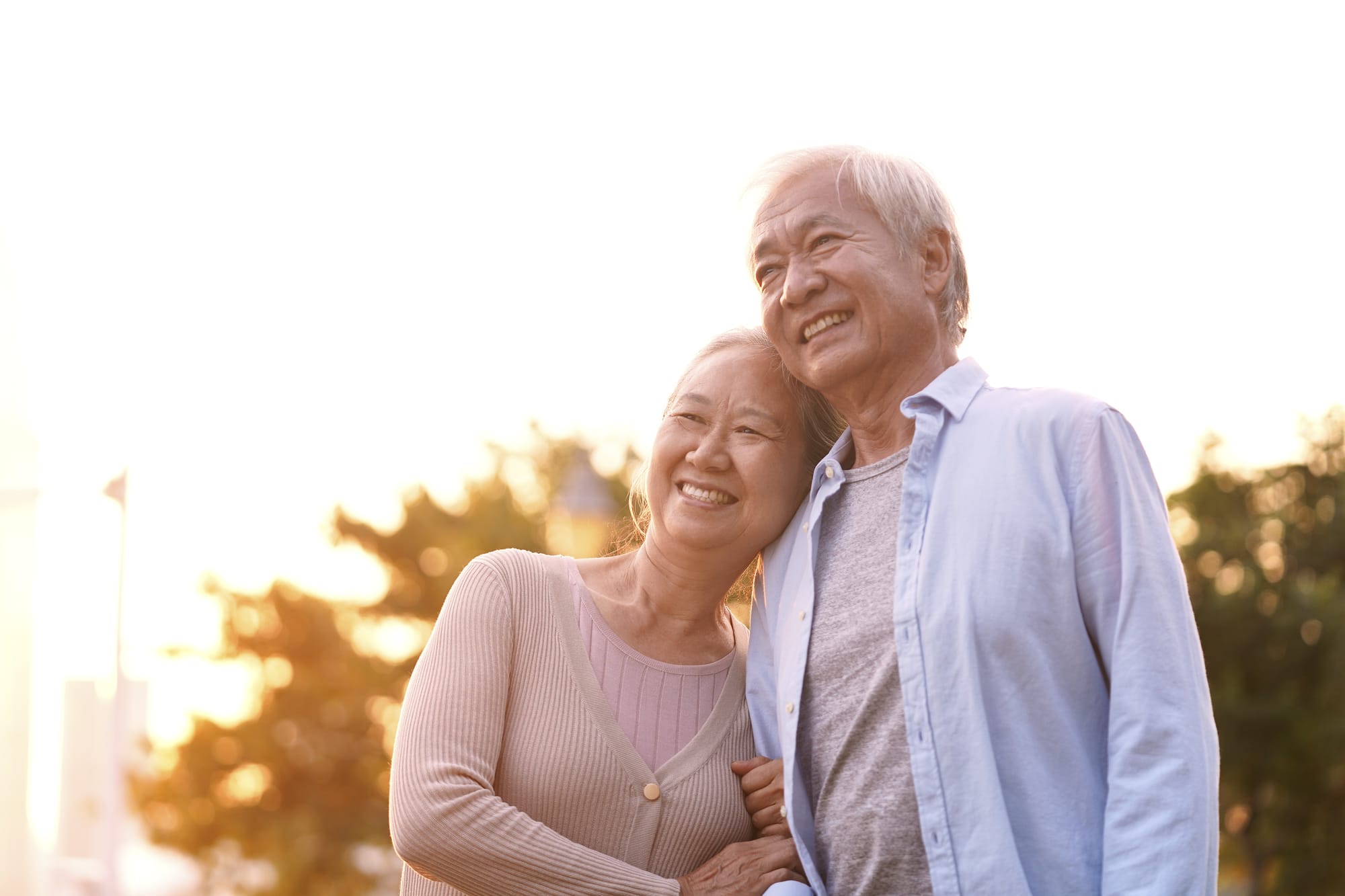 outdoor portrait of loving senior asian couple, happy and smiling